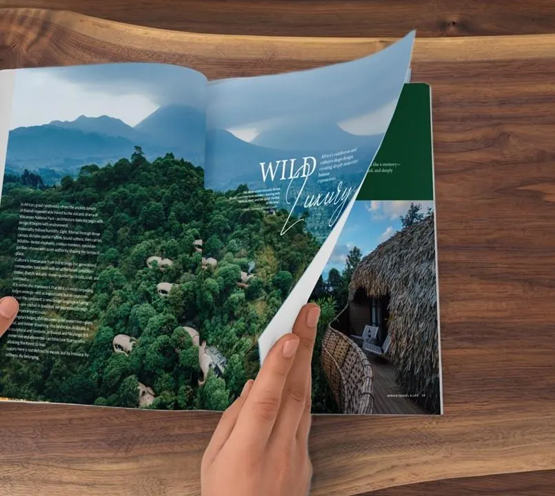 Hands turning to the Wild Luxury spread in Africa Travel and Life